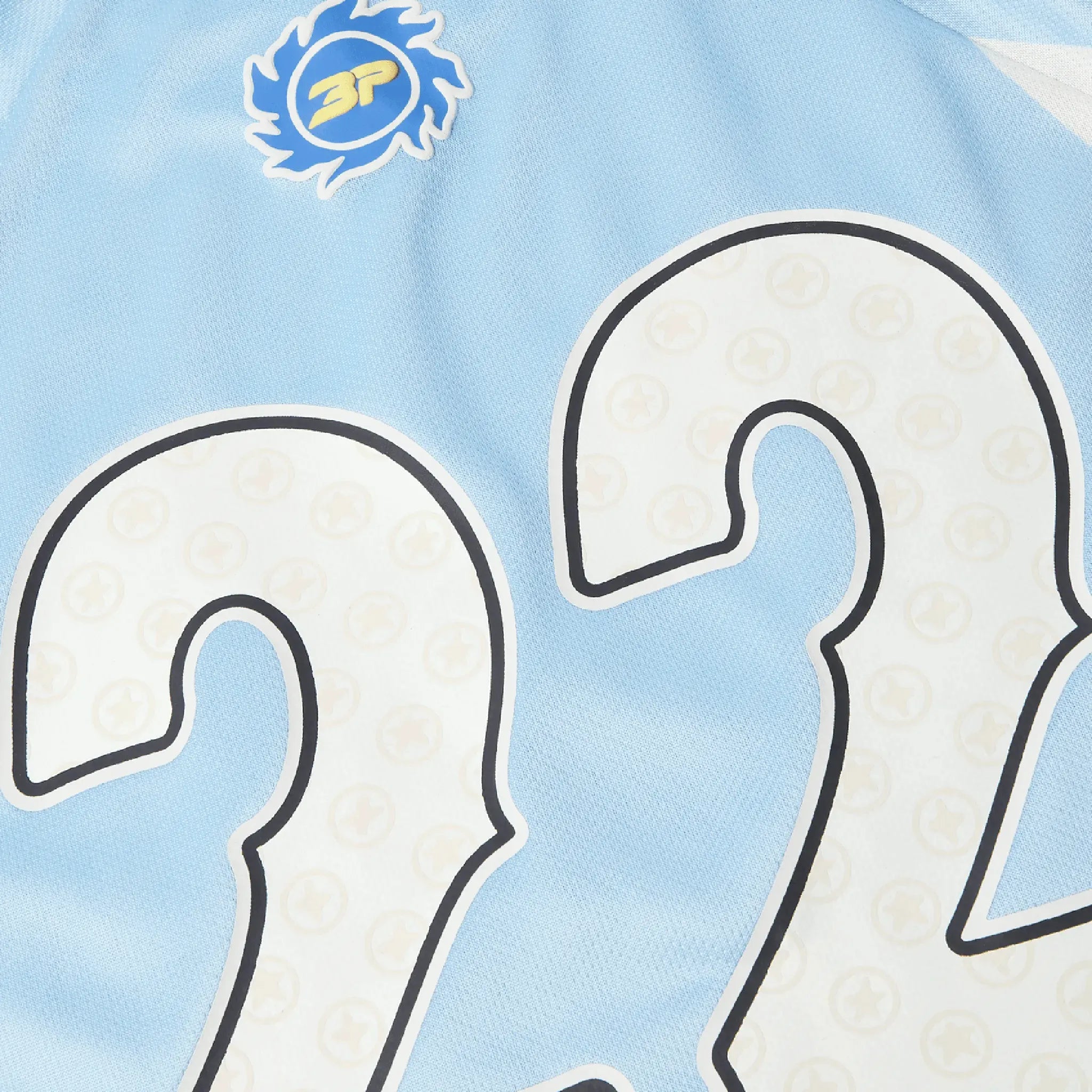 Detail view of Broken Planet Light Blue Football Jersey